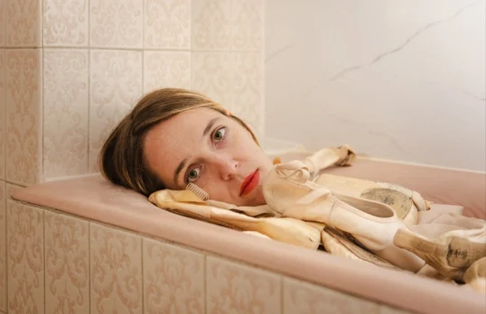 LAGO: Martina resting among ballet shoes